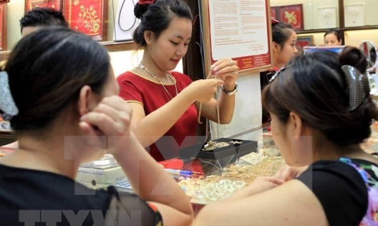 Giá vàng trong nước tăng nhẹ, tỷ giá trung tâm giảm mạnh